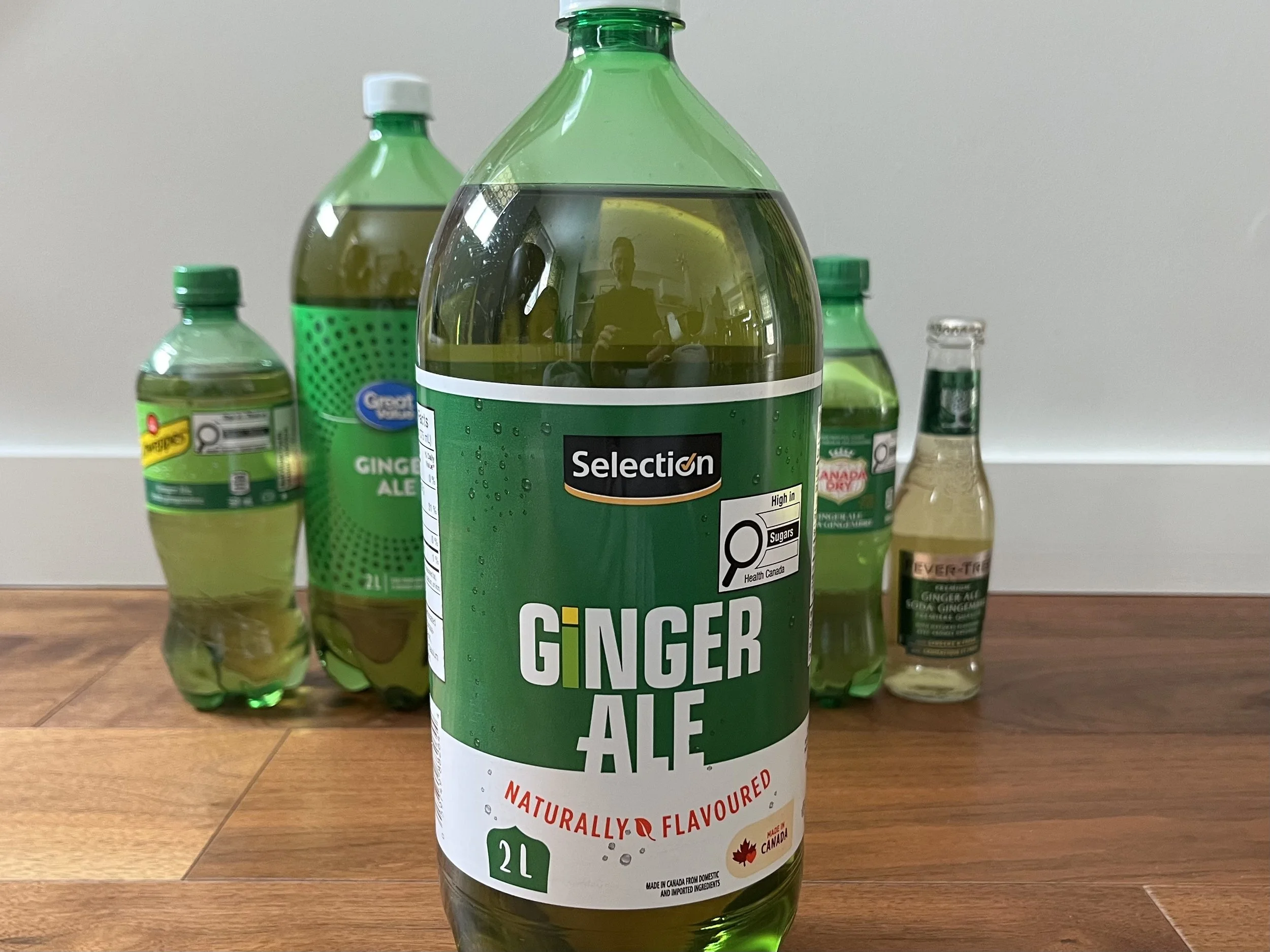 A bottle of Selection ginger ale.
