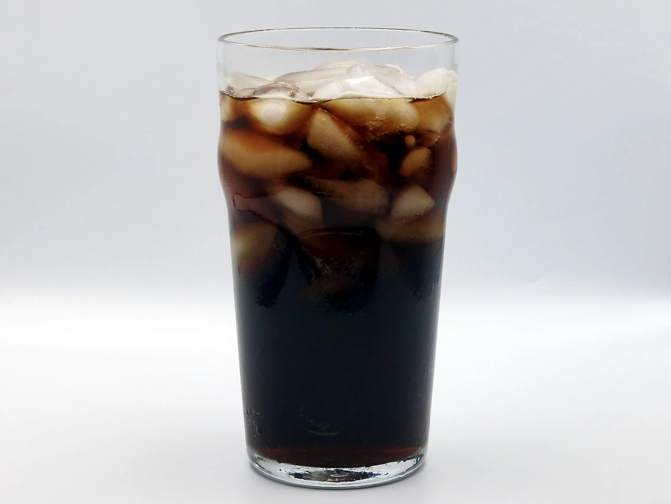 A glass of Dr. Cove cola.