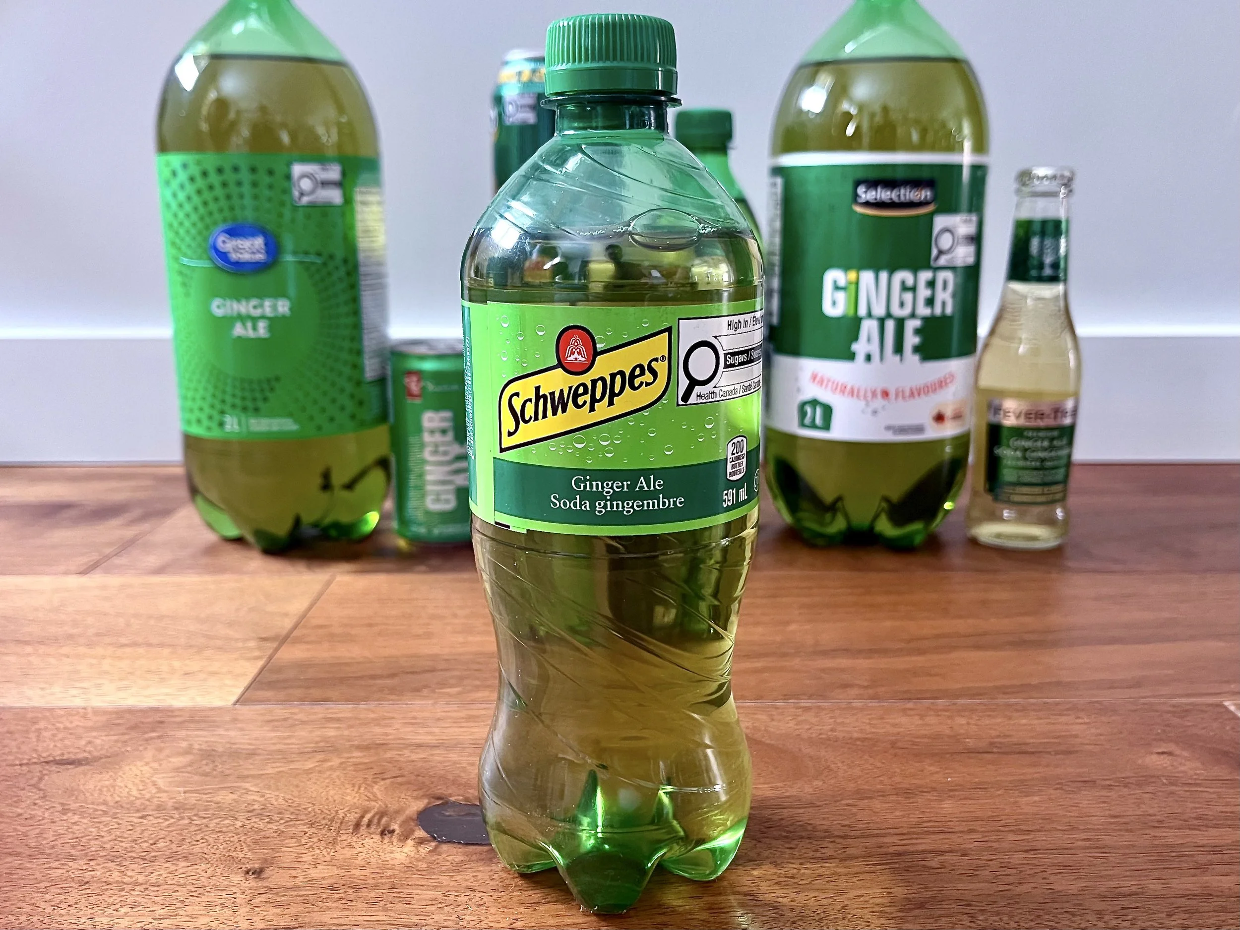 A bottle of Schweppes Ginger Ale.