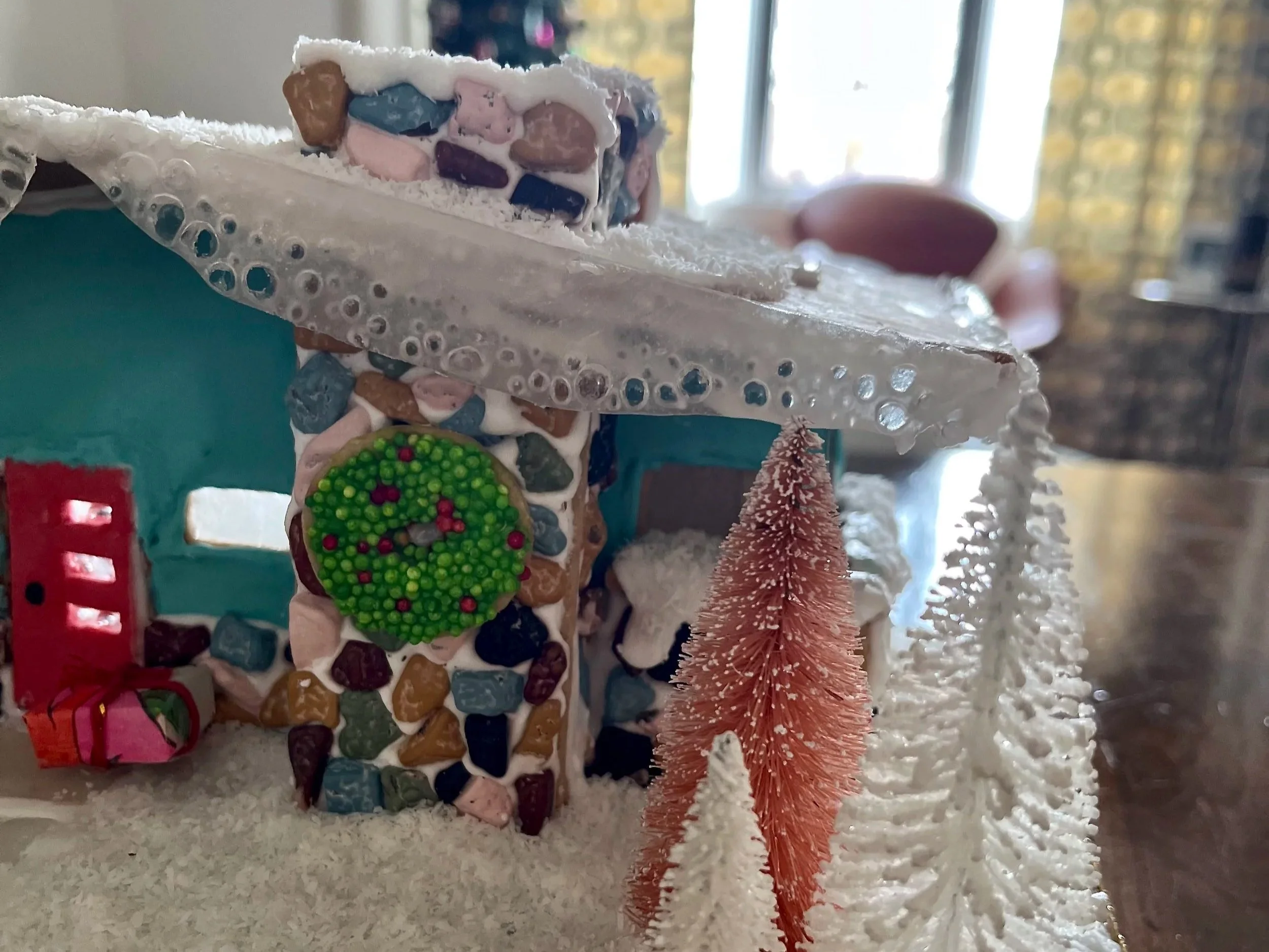 A close up of a mid century gingerbread house
