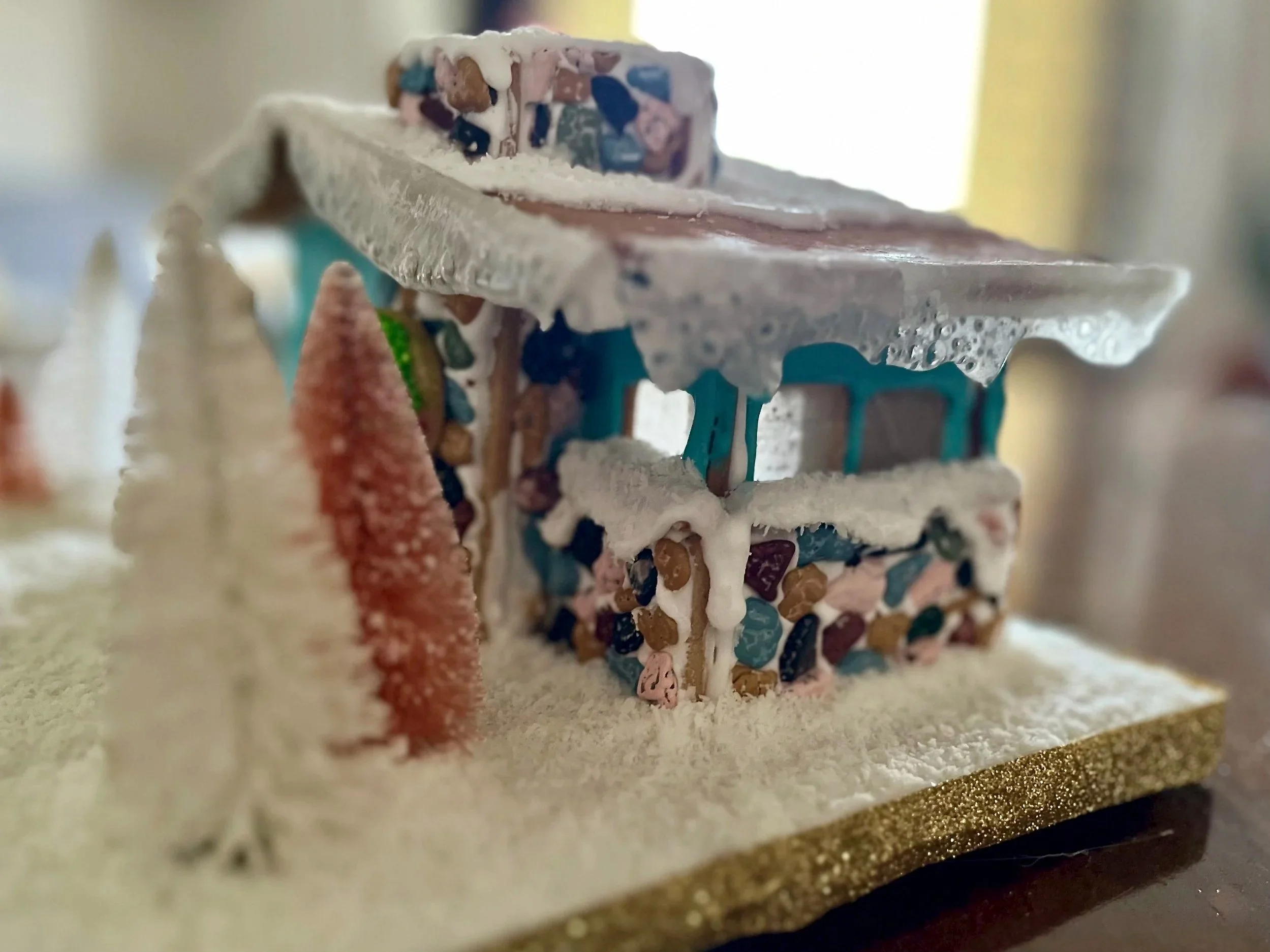 Side of a gingerbread house showing a pebbled window box