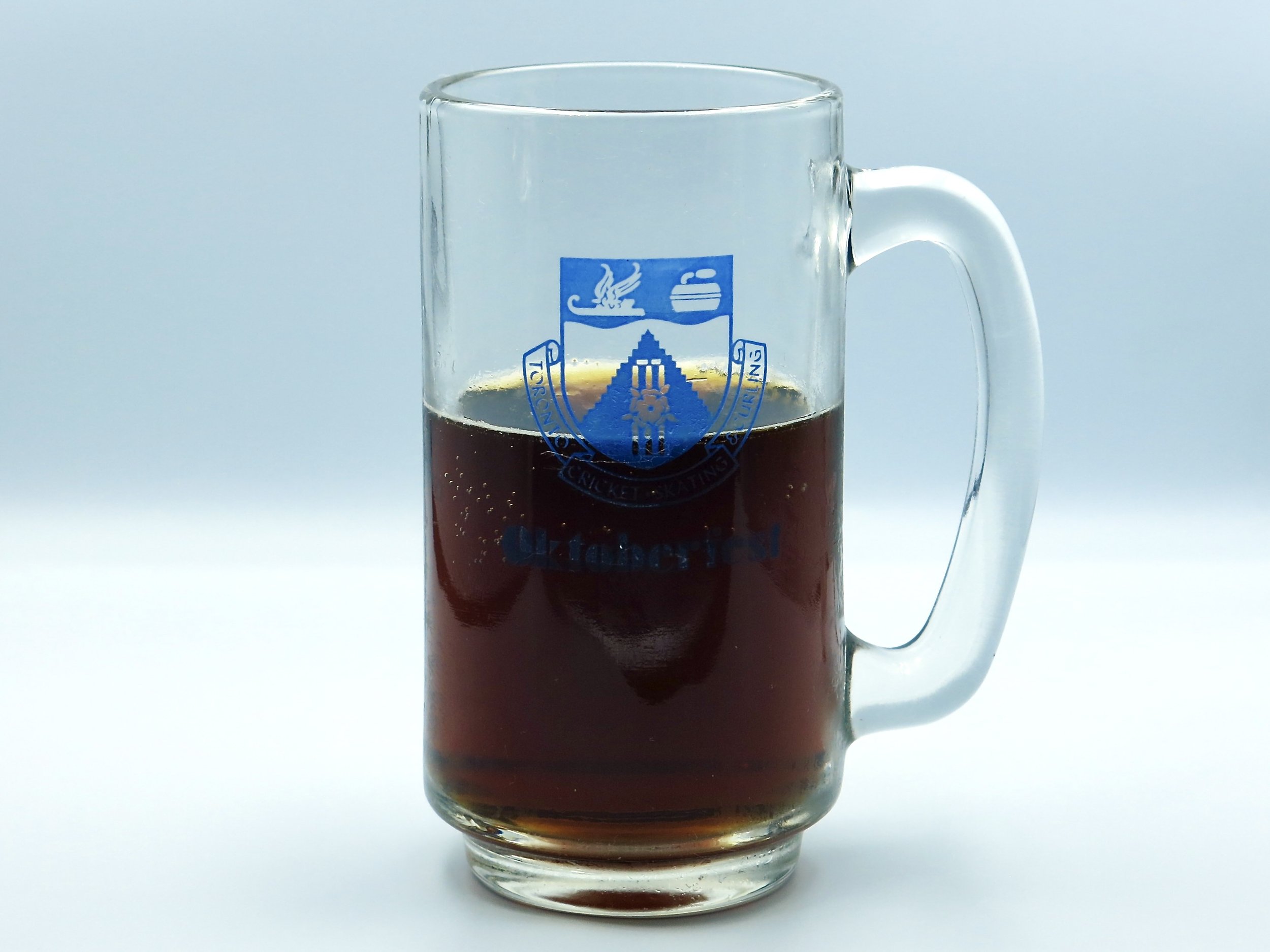 A glass of PC Red Brew beer