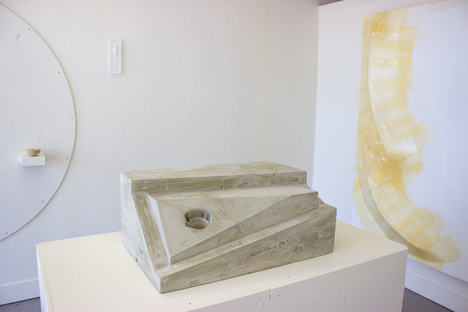  Untitled (concrete shell, rectangle)  2015  Cast concrete altered rectangle, embedded decorative shell&nbsp;  10 x 16 x 24 inches 