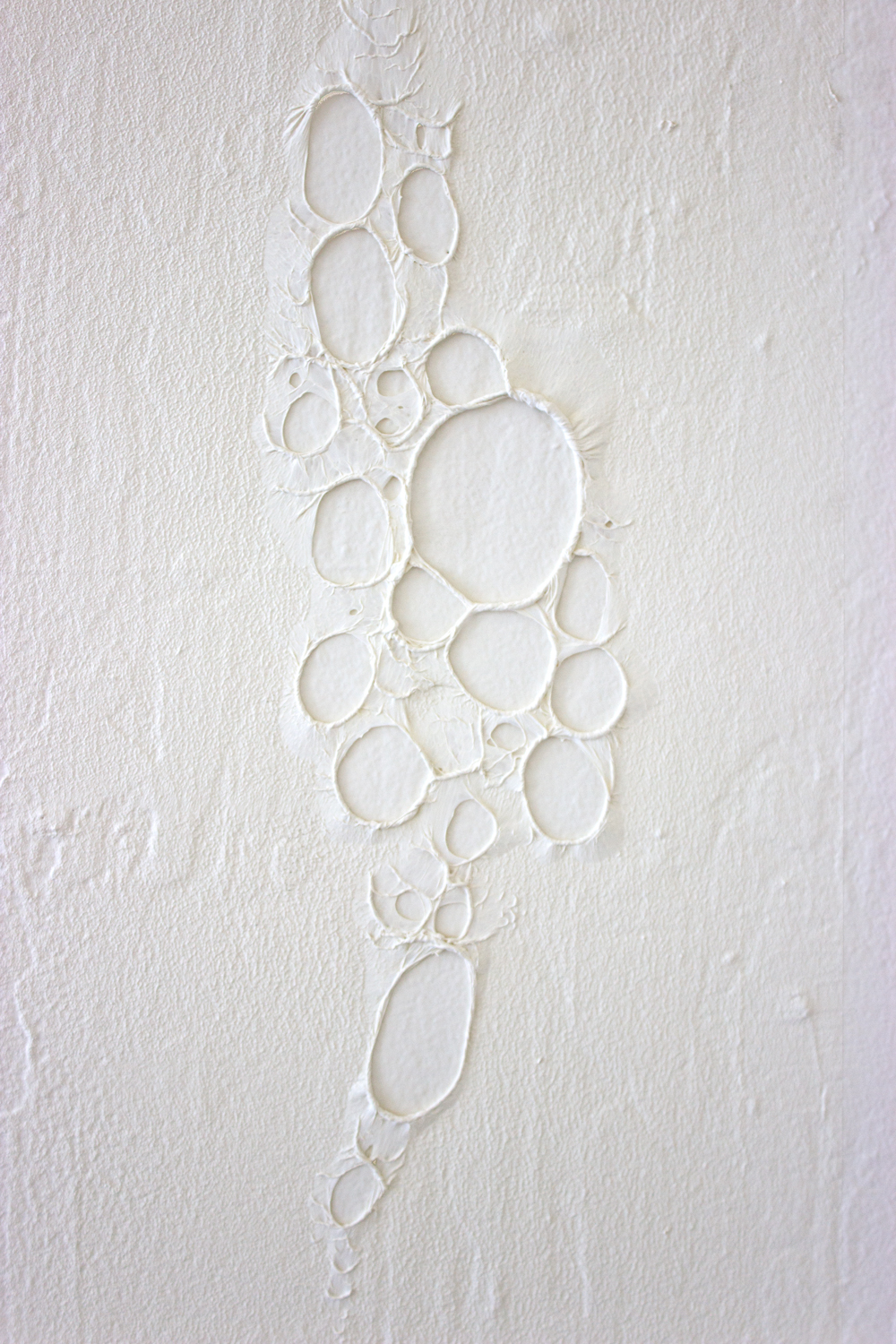  Untitled (latex peel)  2015  Latex mixed with gallery white paint; peeled section shows gallery wall&nbsp;  Temporary installation  Dimensions variable; approx. 12 x 5 inches shown  Detail 