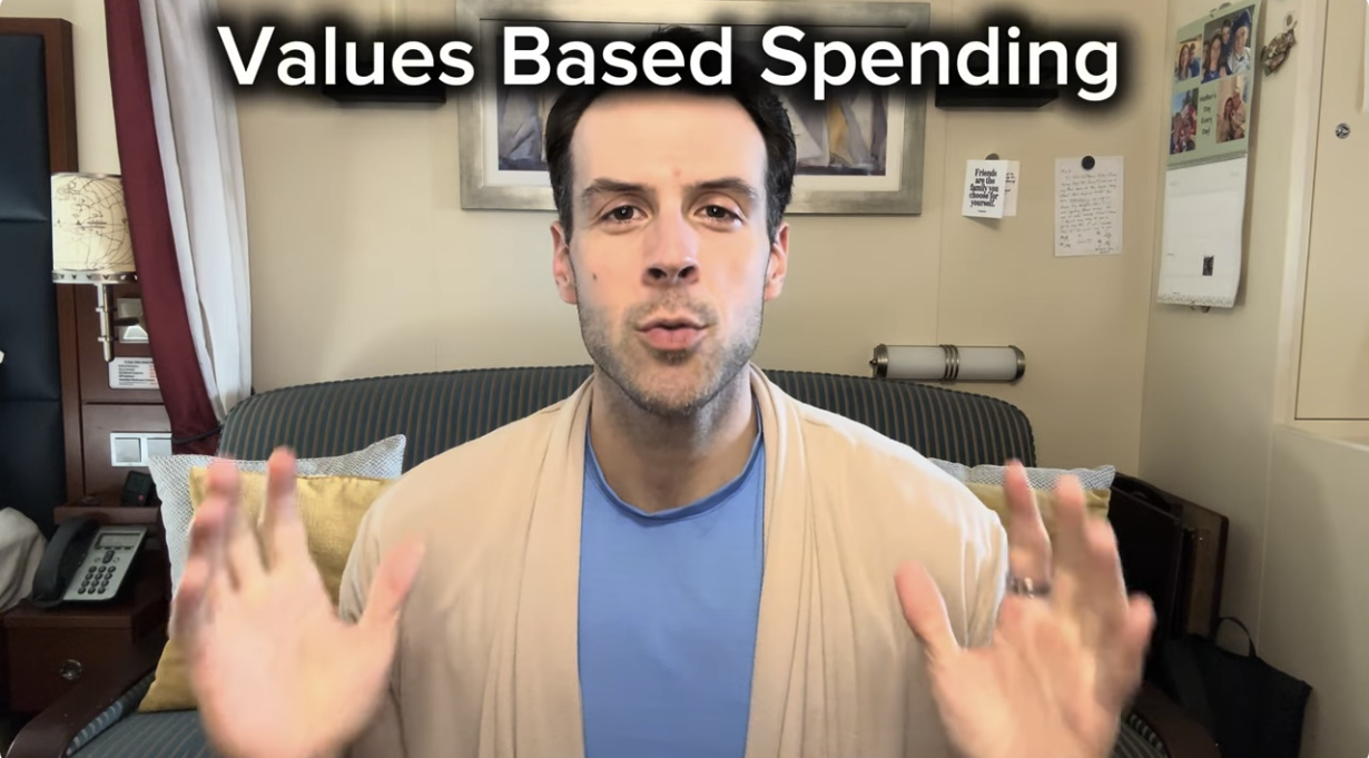 Man speaking in front of a camera with the text 'Values Based Spending' at the top."}
