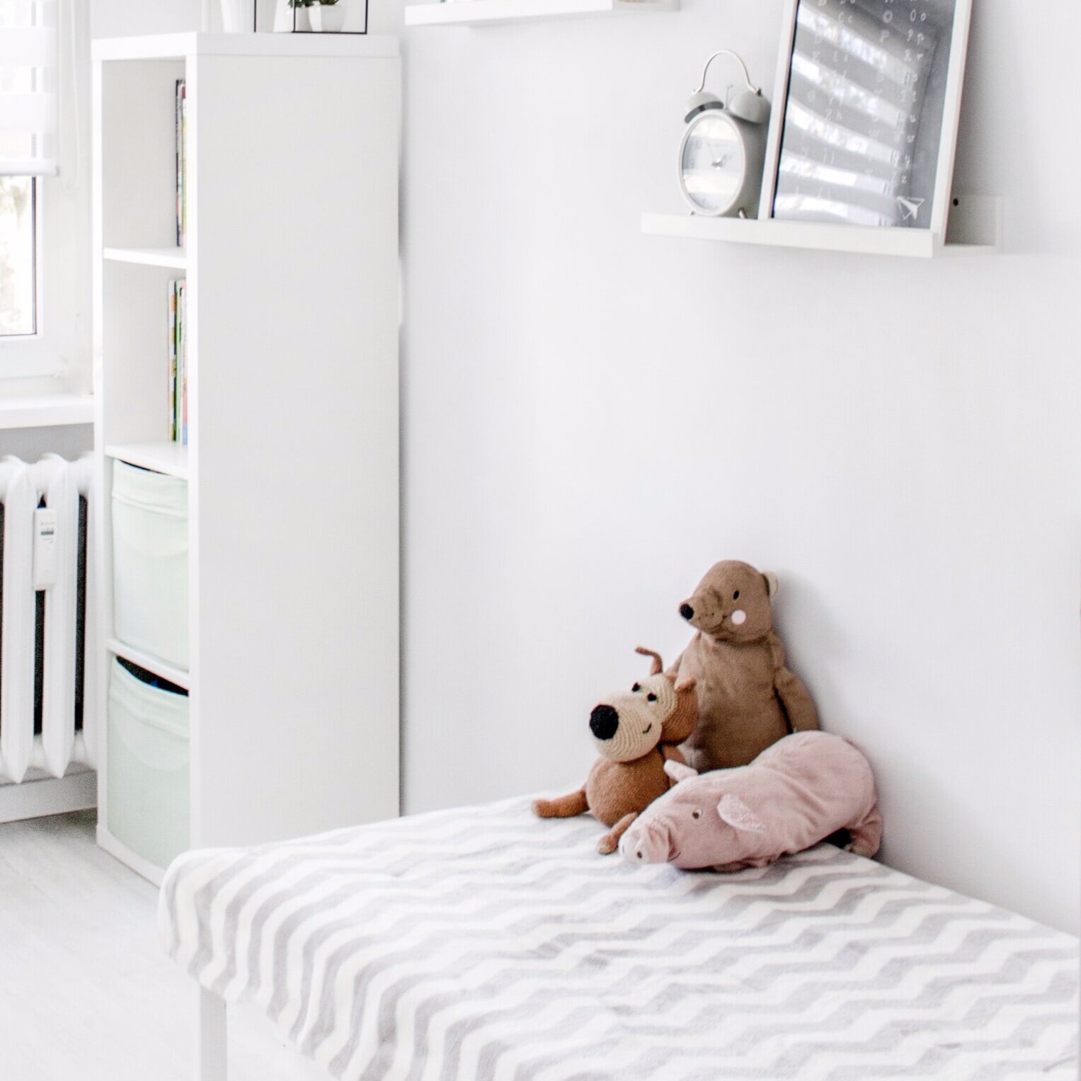 plush-toys-on-top-of-white-and-grey-mattress-inside-bedroom-1139784.jpg