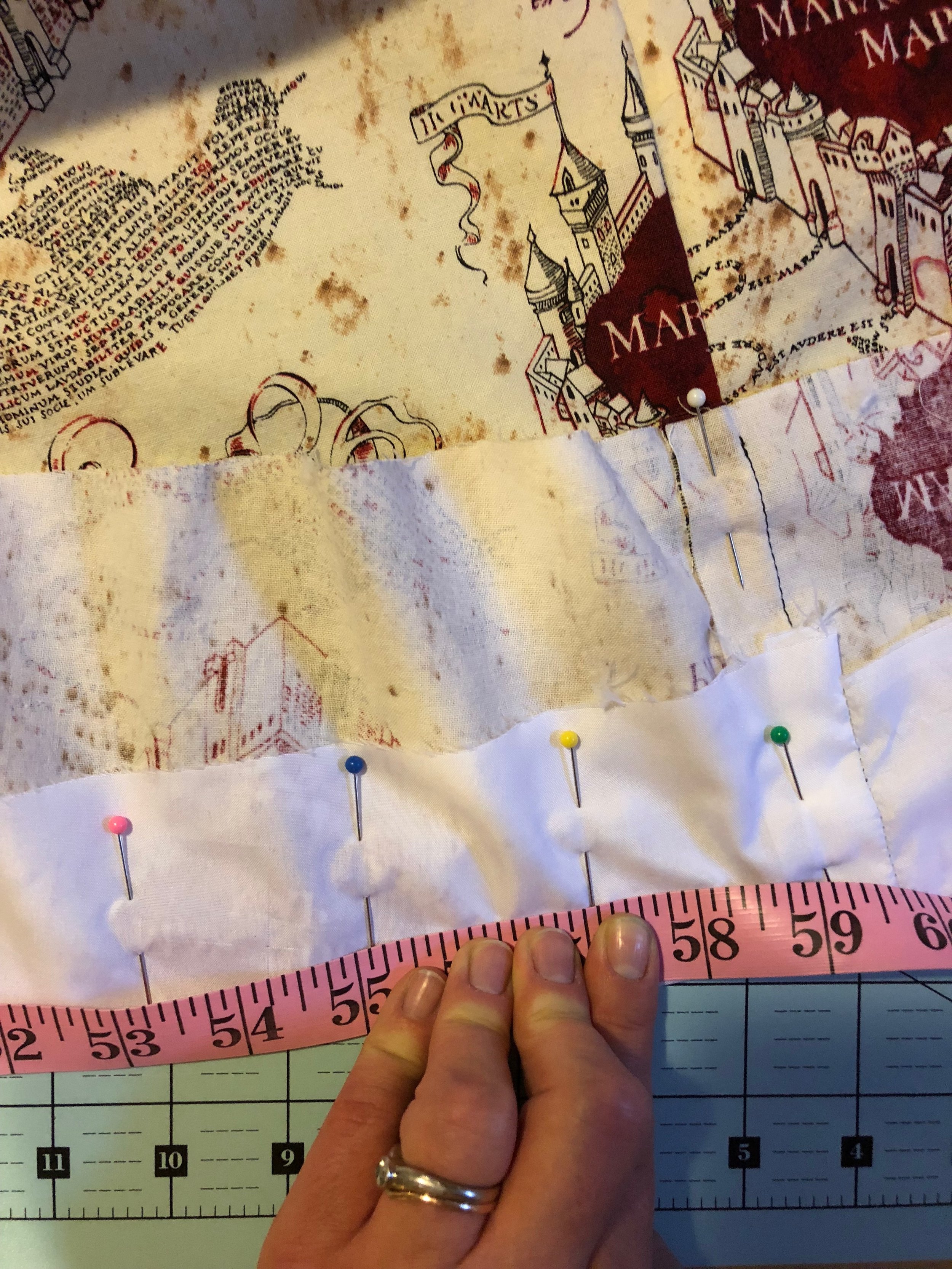  Measuring the hem to calculate the scallops 