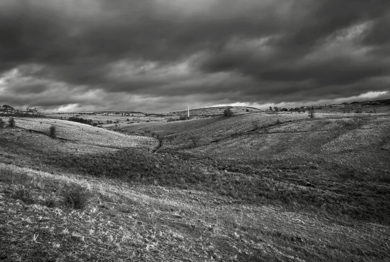 Stoneyford valley between Priest's Hill and Mullaghglass, looking over to Collin on a cloudy day.