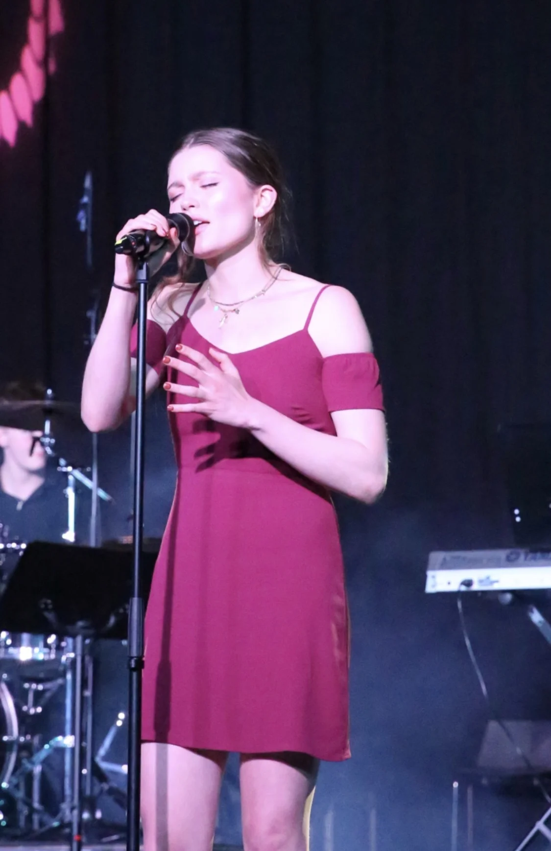 In addition to playing piano and composing, Catherine sings as well.