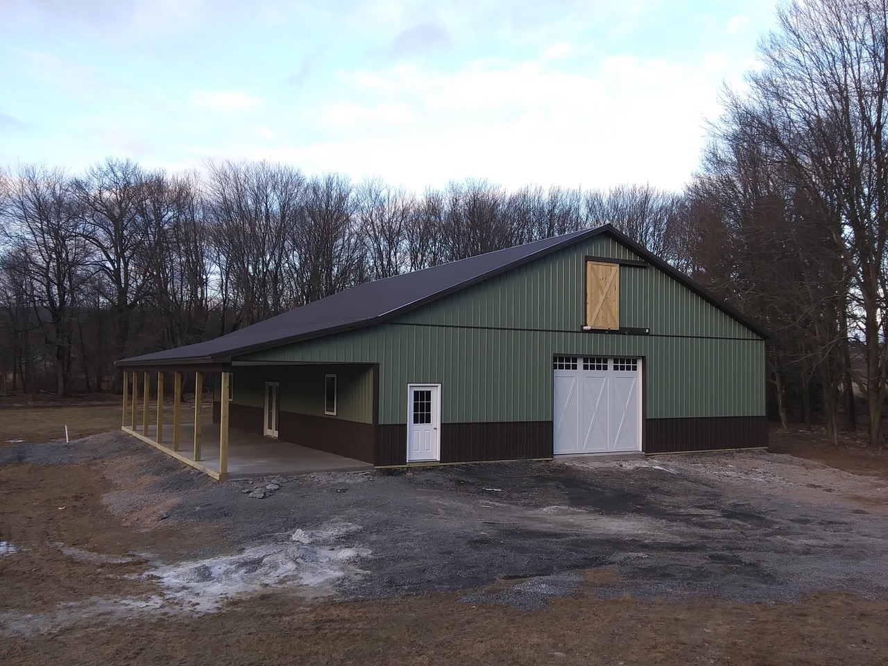 picture book and post board 40’ X 60’ X 12’ w/ open porch Attic trusses Carriage style doors 