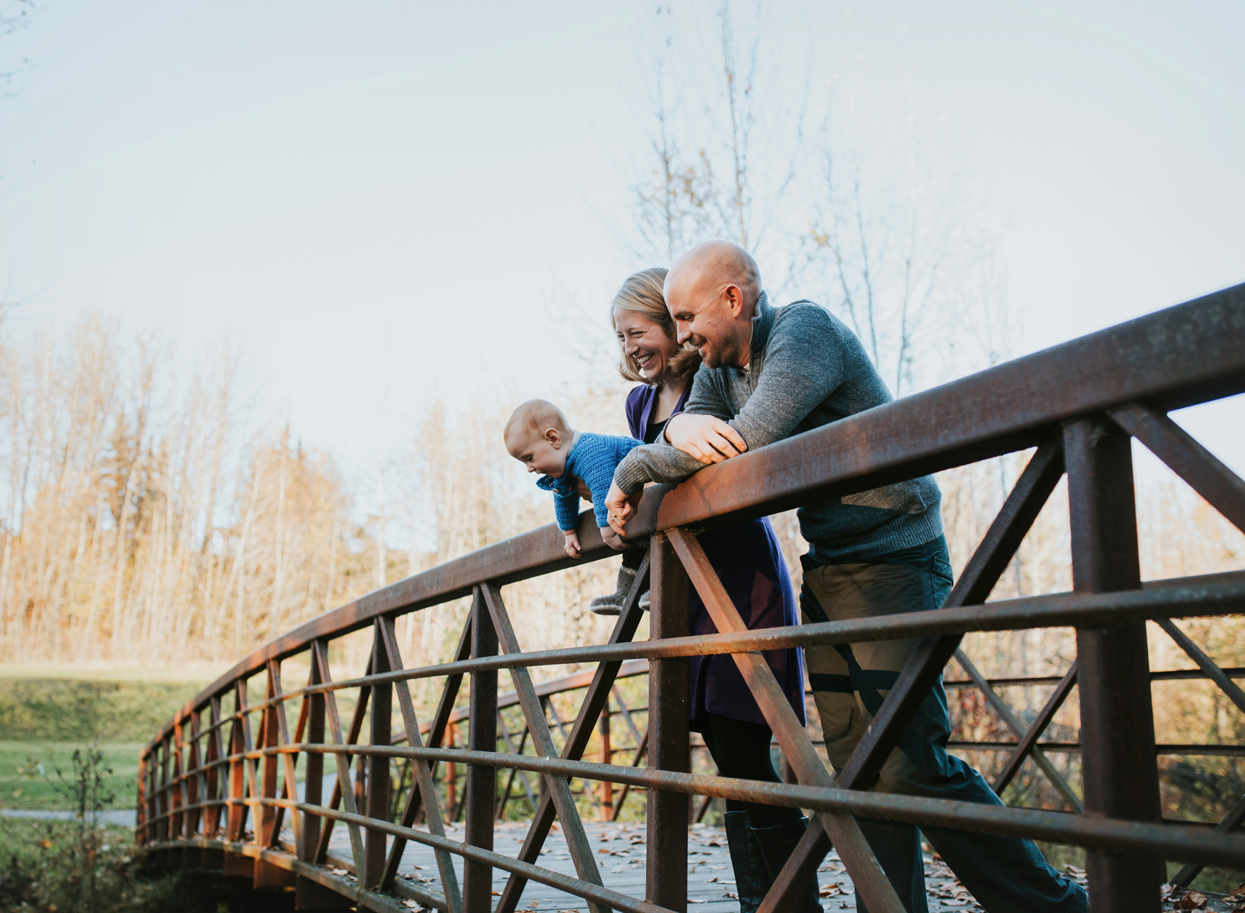 family on chester creek trail bridge