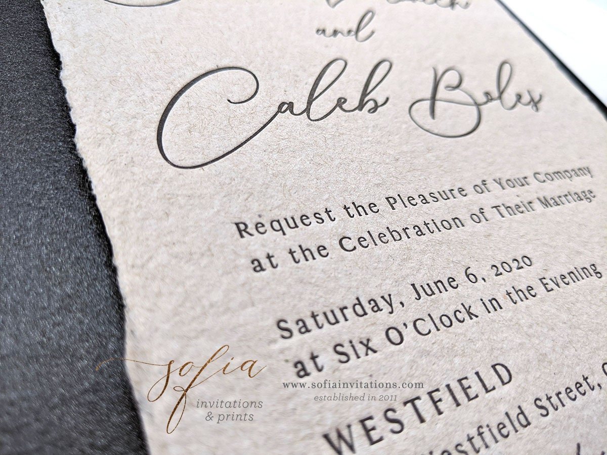 Custom invitation suite on linen board with hand torn paper and leather  envelope pou…