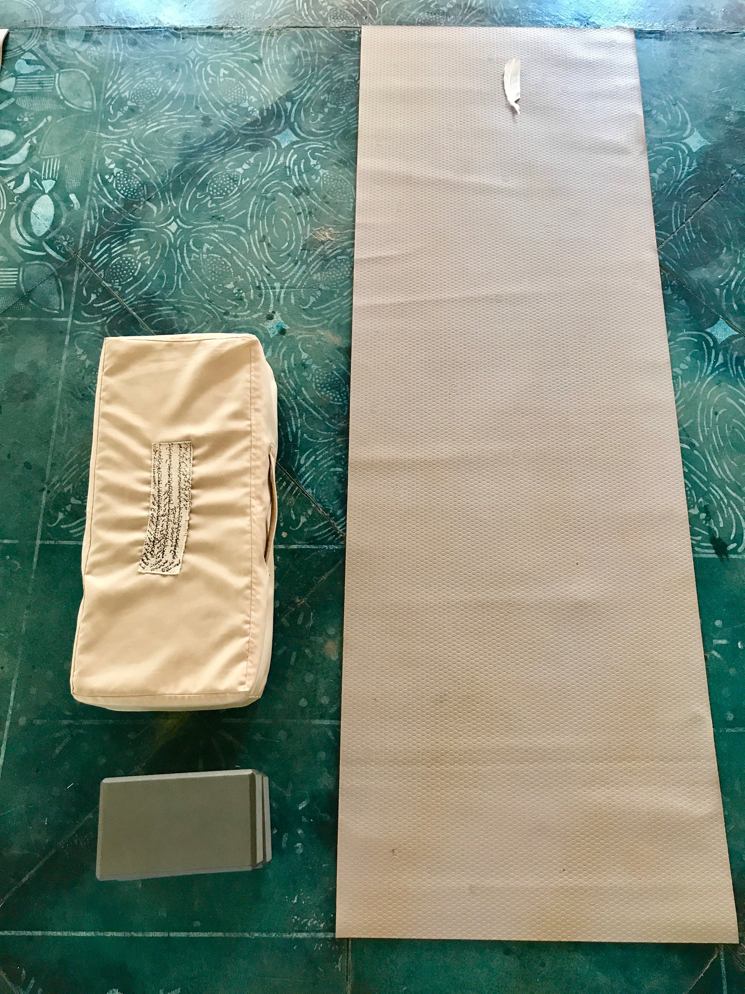 All the magic's in the details. Like bolsters hand stitched with Arabic poetry