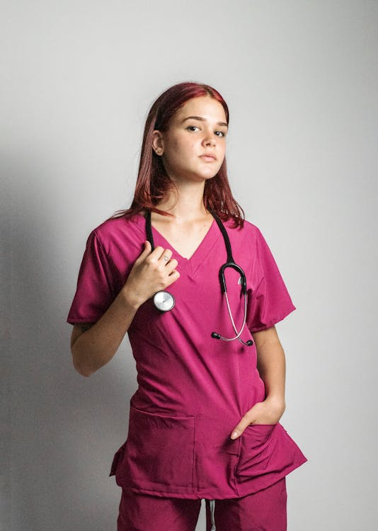 A doctor in bright colored scrubs.