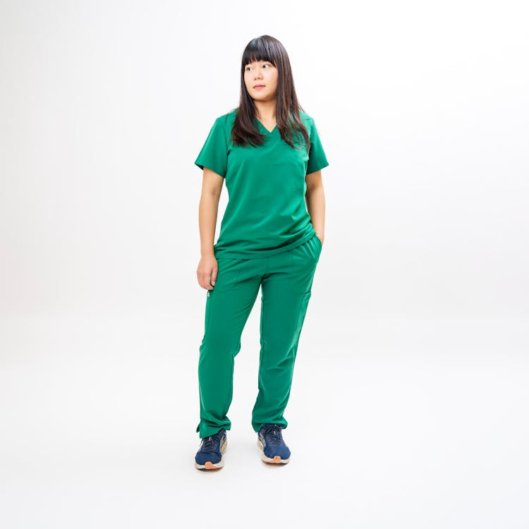 A nurse wears sleek, smart scrubs that are spacious.