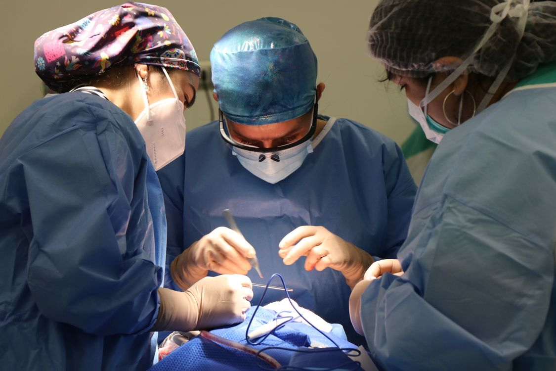 A group of surgeons working in an operating room.