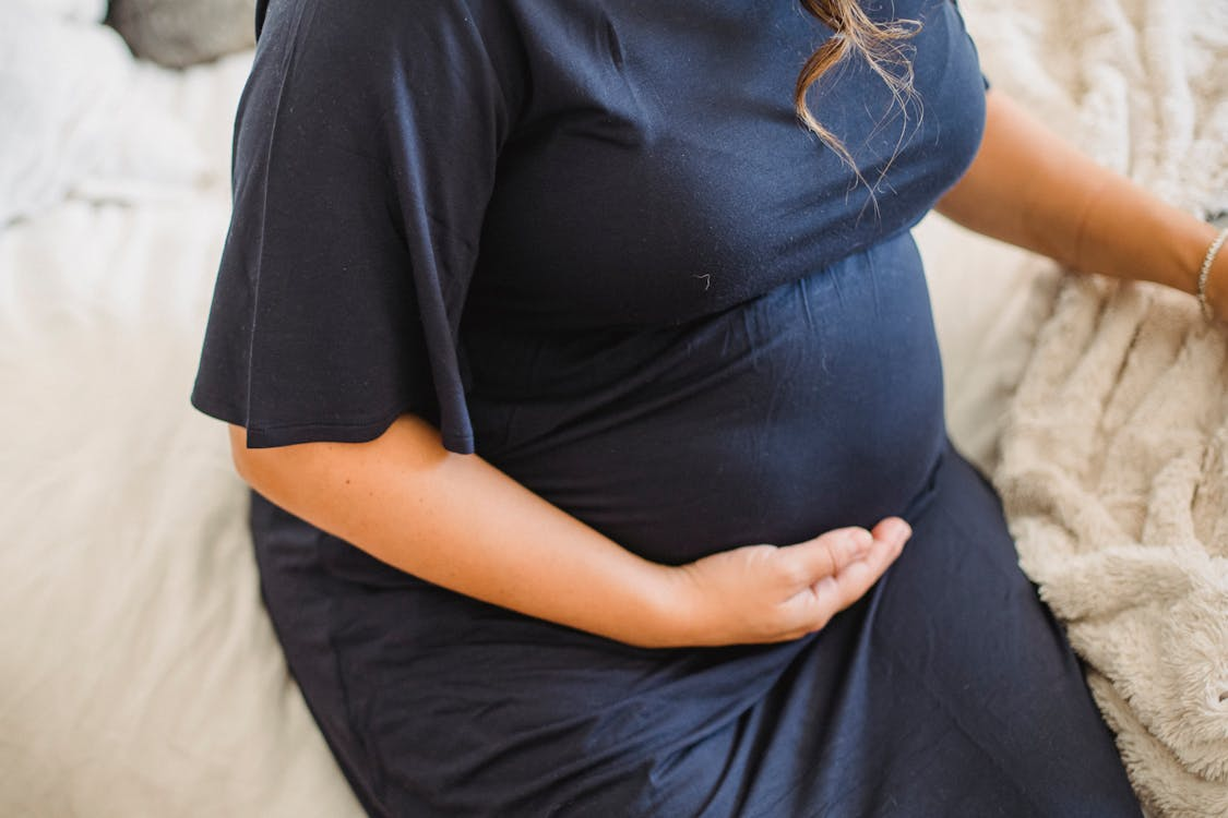 A woman in a birthing gown.