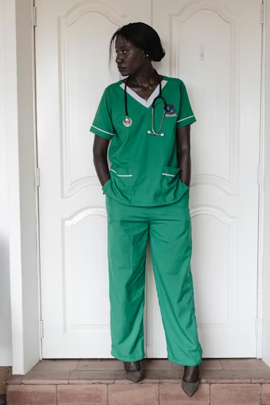 A healthcare worker tests out unique scrub designs.