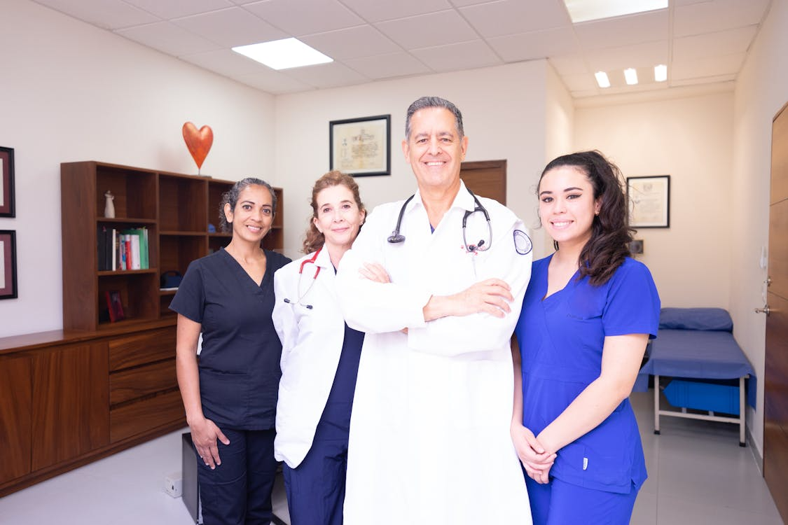 Staff at a clinic wearing scrubs.