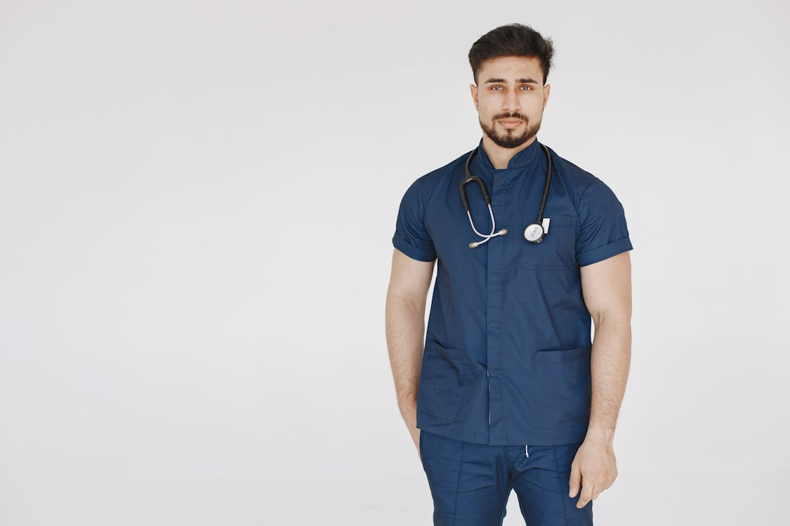 A nurse in functional scrubs.