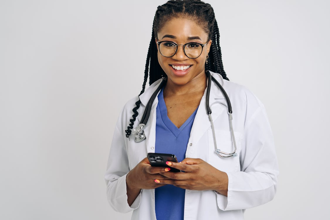 A doctor wears safety scrubs.