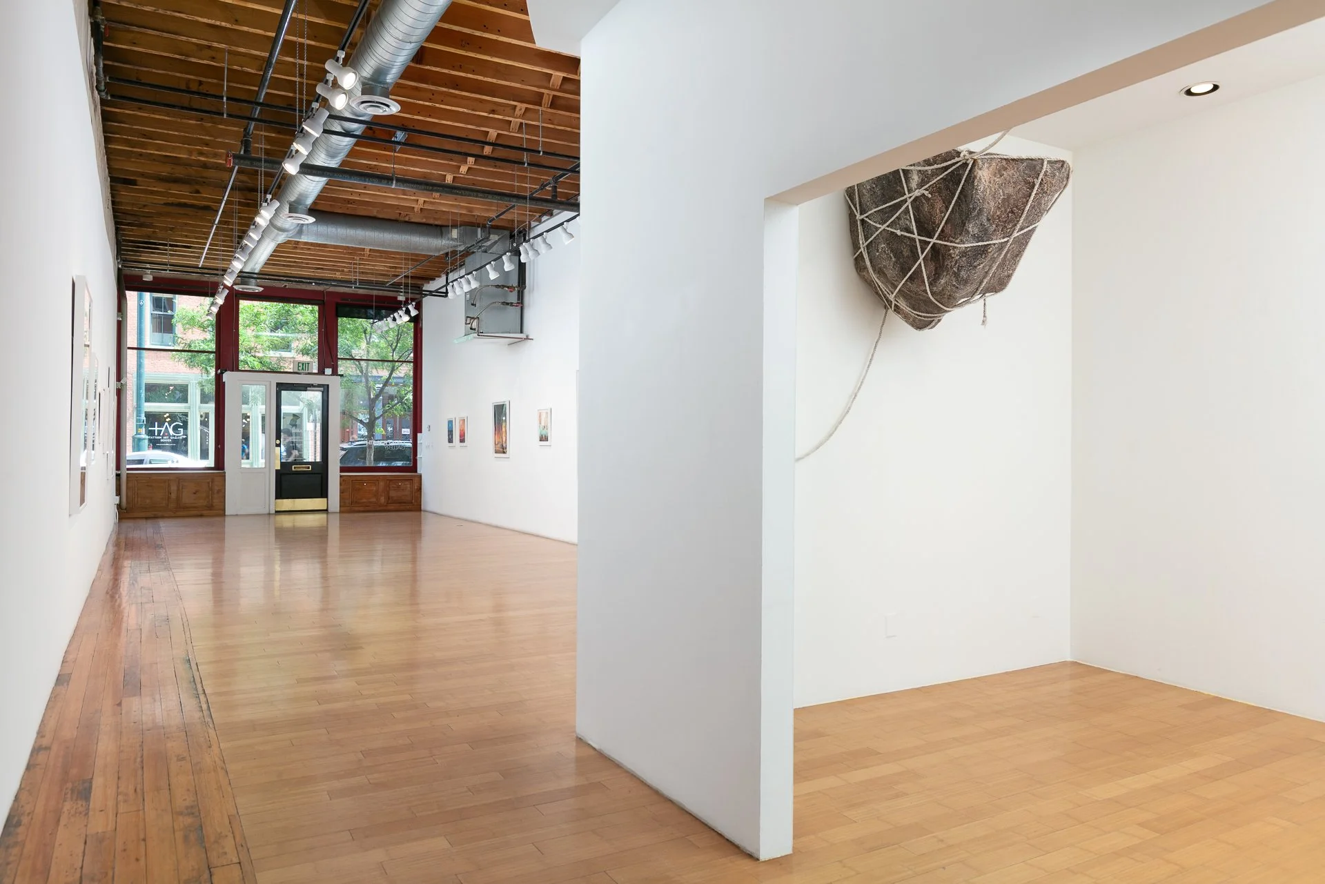 Enduring Gravity (installation detail) paper mâché, rope, wood, hardware, graphite on paper Dimensions variable 2025