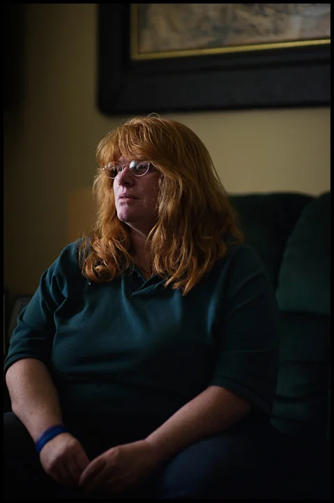 "It's not a choice I wanted for myself," said Lori Cole, 51 of Bowling Green. 30 years ago she walked into an abortion clinic and says she can still see and hear everything about the experience. A year into a new marriage, Cole was pressured into the decision by her then husband who said the child would put to much strain on the couples finances. Here she poses for a portrait at her home on Thursday, May 1, 2014. Photos by Brian Powers