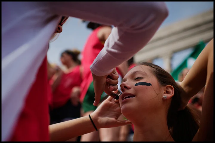 Kappa Delta sophomore and Marketing major Brooke Sage, left, of Franklin, TN, puts face paint onto fellow KD Mikaela Layer, a freshman PR major from Nashville before greek weeks events day at the Colonnade on Thursday, April 10, 2014. This years eve