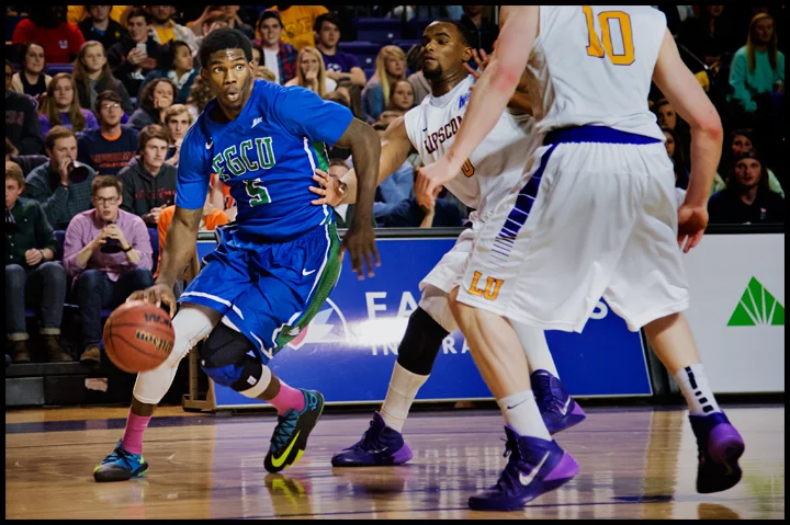 Florida Gulf Coast University's Jamail Jones tries to dribble around Lipscomb University's Khion Sankey (0) and Talbott Denny (10) during their game at Lipscomb University in Nashville, TN on Thursday, February 27, 2014. FGCU would go on to loose 93-71. Photos by Brian Powers