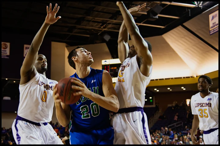 Florida Gulf Coast University's Chase Fieler tries to get a shot off between Lipscomb University's Khion Sankey, left, and Malcolm Smith, right, during their game in Nashville, TN on Thursday, February 27, 2014. FGCU would go on to loose 93-71. Photos by Brian Powers