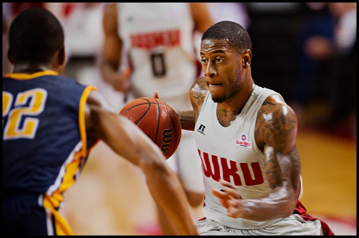 WKU's Trency Jackson drives to the net as The Hilltoppers take on Murray State at E.A. Diddle Arena on Saturday, December 21, 2013. Western would go on to win their sixth straight home game 71-64. Photos by Brian Powers