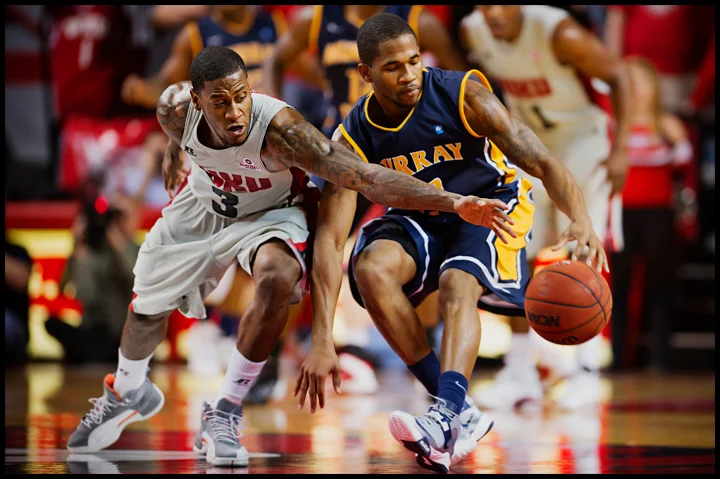 WKU's Trency Jackson tries to steal the ball from Murray State's T.J. Sapp as the Hilltoppers take on Murray State at E.A. Diddle Arena on Saturday, December 21, 2013. Western would go on to win their sixth straight home game 71-64. Photos by Brian Powers
