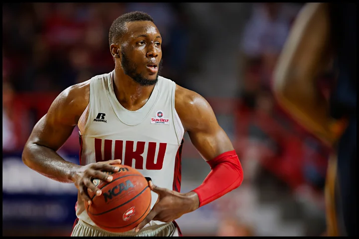 WKU's T.J. Price had a big second half to help push the Hilltoppers over Murray State 71-64 at E.A. Diddle Arena on Saturday, December 21, 2013. Photos by Brian Powers