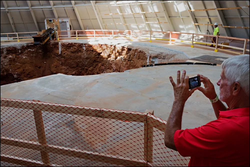 "I've seen it on TV but before seeing it in person you just don't realize what it is," said Larry Gulau of Toledo, OH when he saw the sinkhole at the National Corvette Museum in Bowling Green, KY, on Wednesday, June 25, 2014. Gulau and his wife made the trip just to see the sinkhole in person. Photo by Brian Powers