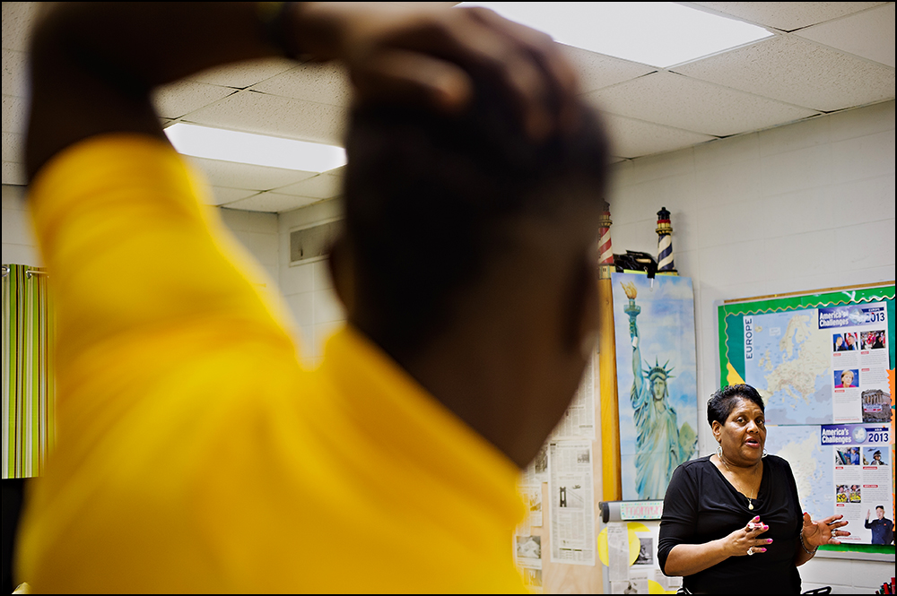 Teacher Bettye Williams answers a students question at H.W. Byers High School in Holly Springs, Miss. on Monday, August 11, 2014. Photos by Brian Powers