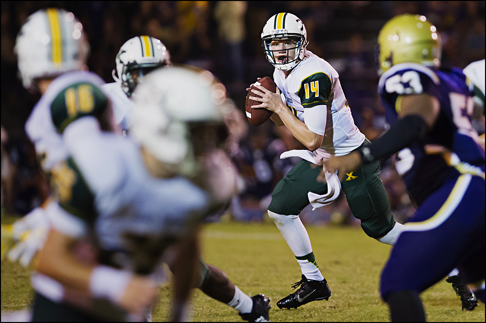  St. Xavier quarterback Noah Houk (14) looks for a pass during the Tigers game against Bowling Green at Bowling Green High School on Friday, September 5, 2014. The Tigers would loose in overtime 6-0. Photos by Brian Powers 