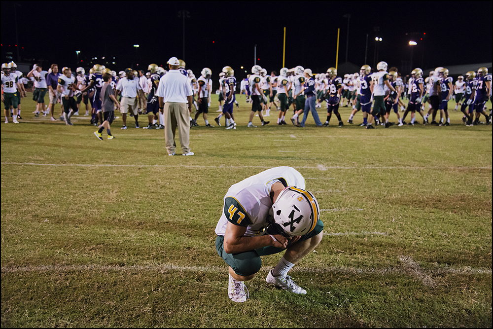  St. Xavier's Sam Taylor (47) crouches for a moment after the Tigers 6-0 overtime loss to Bowling Green High School at Bowling Green on Friday, September 5, 2014. Photos by Brian Powers 