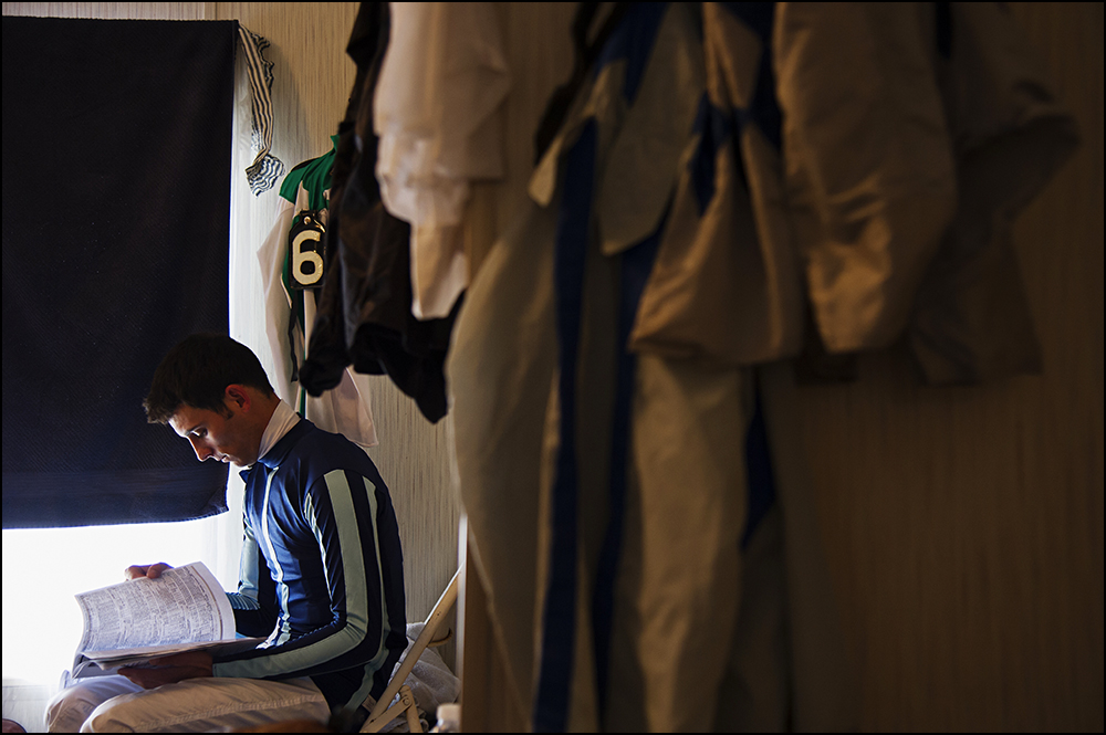  26 year old jockey Chris Landeros, from California, looks over the race sheet while preparing for his third race of the day at Kentucky Downs race track in Franklin, Ky. on Wednesday, September 10, 2014. By Brian Powers, Special to the CJ, 09/08/201