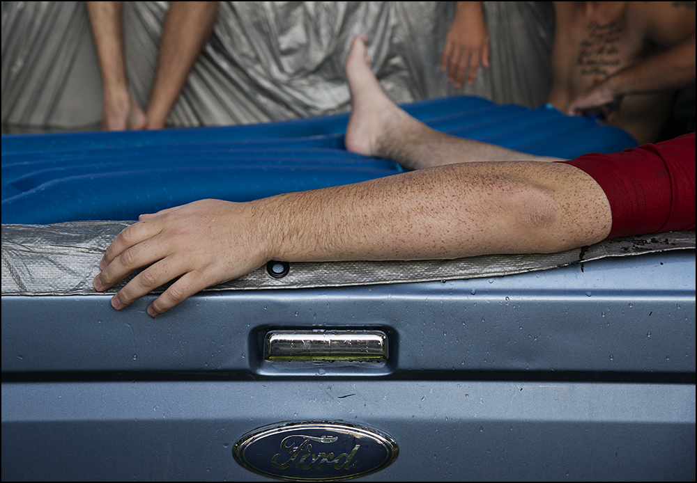  Members of the Alpha Gamma Row fraternity relax in a makeshift pool in the back of a truck just of the campus of WKU in Bowling Green, KY on Friday, September 5, 2014. Photos by Brian Powers 