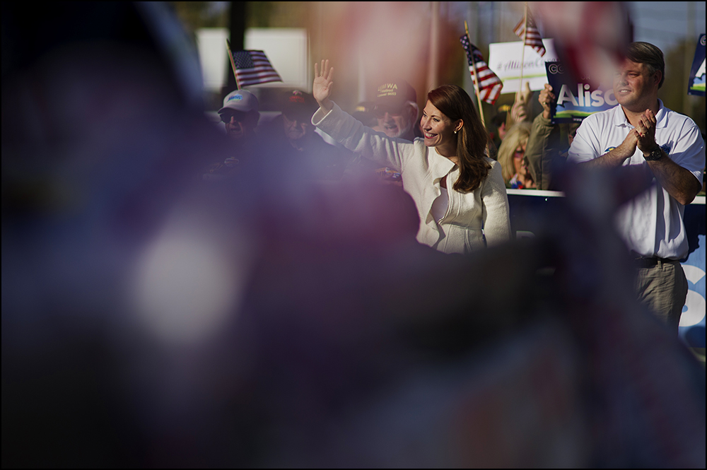  Allison Lundergan Grimes waves to parade watchers as she walks in the 50th annual Veteran's Day Parade in Madisonville, Ky. on Sunday, November 2, 2014. Brian Powers/Special to the Courier-Journal 