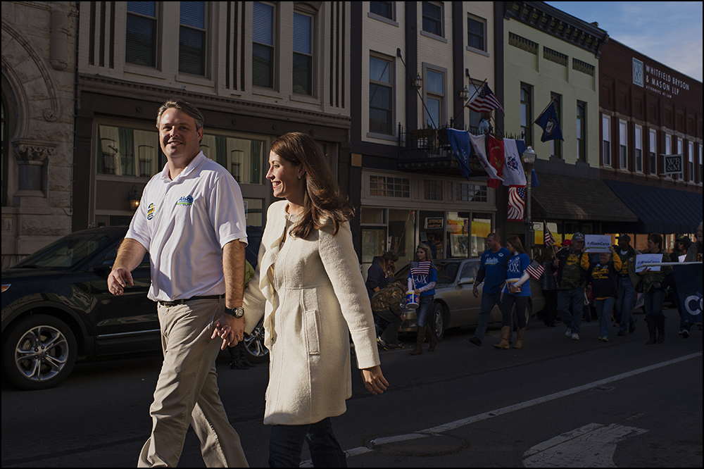  Allison Lundergan Grimes, right, walks the 50th annual Veteran's Day Parade in Madisonville, Ky. with her husband Andrew Grimes, left, on Sunday, November 2, 2014. Brian Powers/Special to the Courier-Journal 