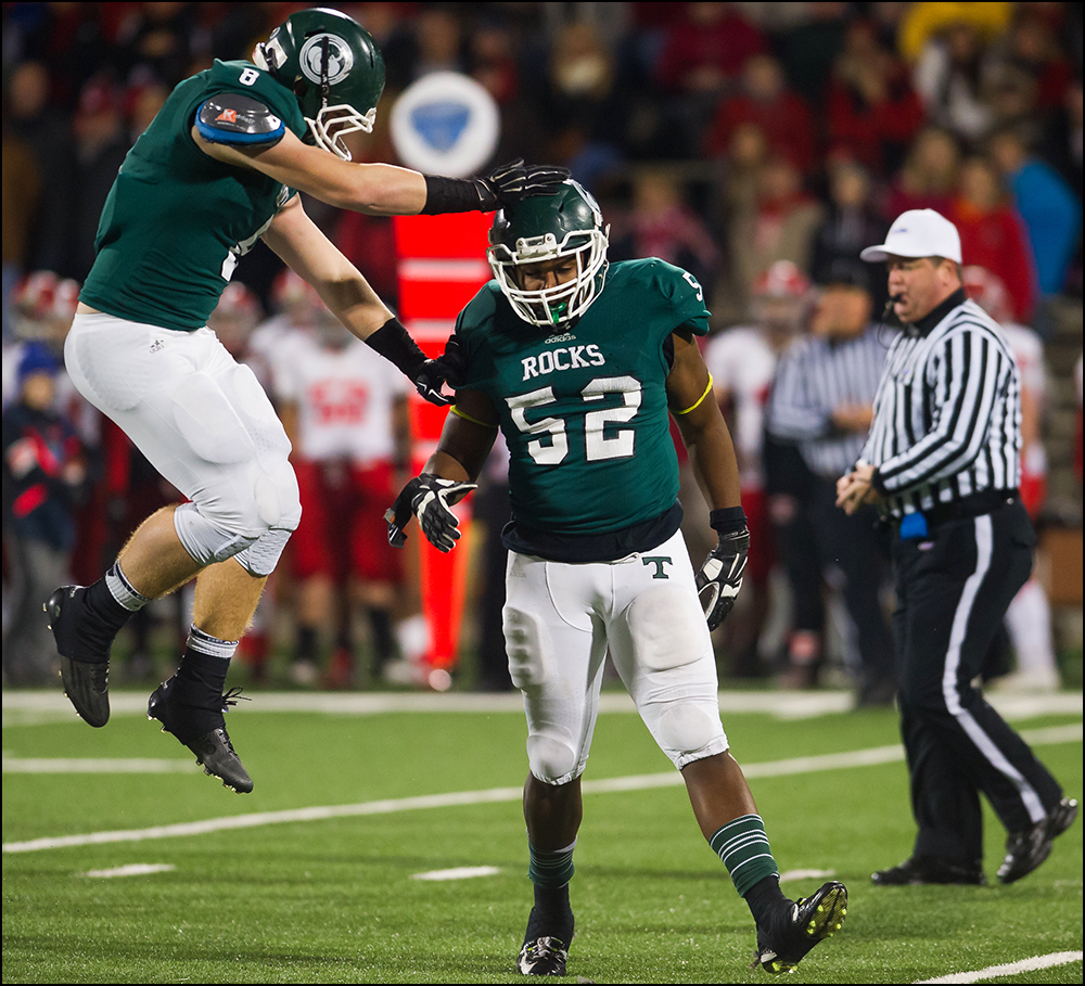  Trinity's Damon Lowe, right, is congratulated by Zach Berger after a sack during the Shamrocks game against Dixie Heights during their KHSAA Commonwealth Gridiron Bowl game at Western Kentucky University in Bowling Green, KY on Saturday, December 6,