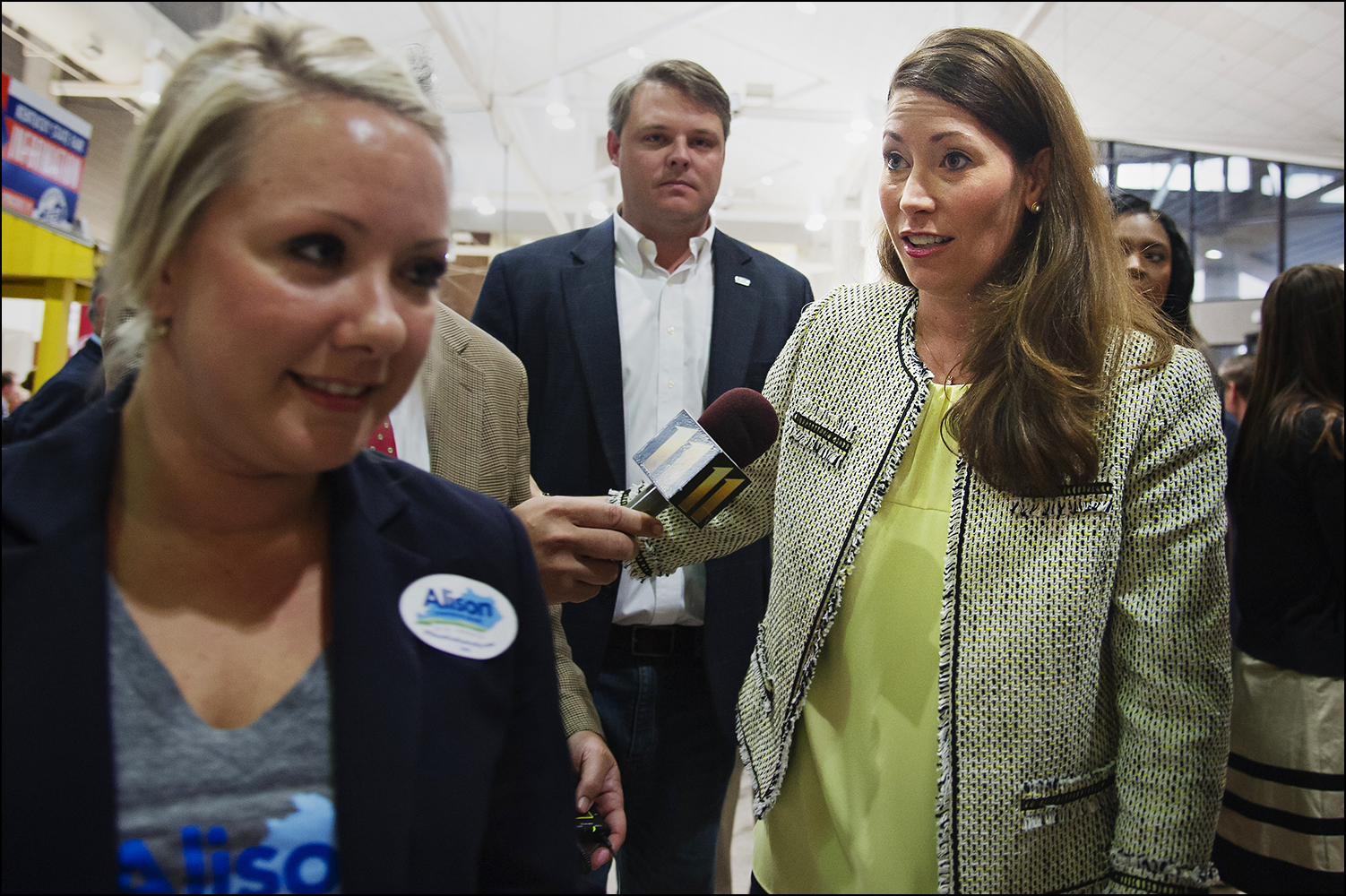  Kentucky Secretary of State and U.S. Senate candidate Alison Lundergan Grimes is greeted by media members after arriving at the 51st annual Kentucky Country Ham Breakfast at the state fair in Louisville, KY on Thursday, August 21, 2014. Photos by Br