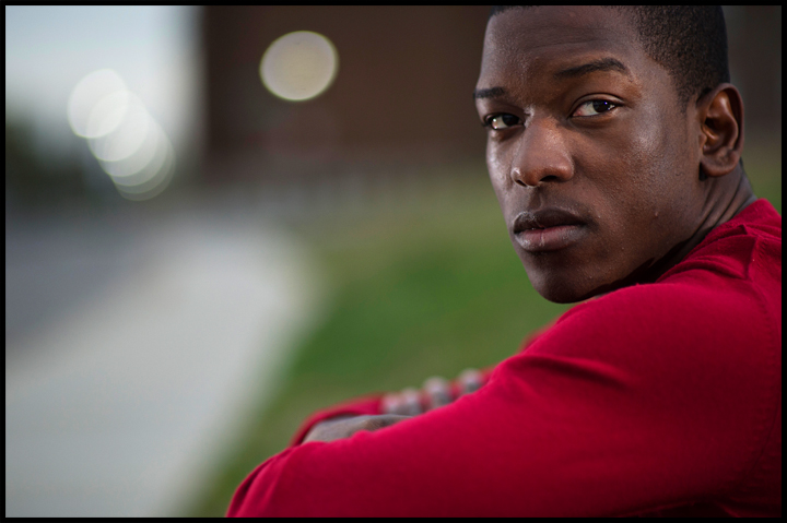  Miami senior Nick Gilyard poses for a portrait along Kentucky street where a few weeks ago he was walking up the street and a vehicle drove by, shouted a racial slur and threw a cup of ice at him. "I watch movies about racism and I've read about it,