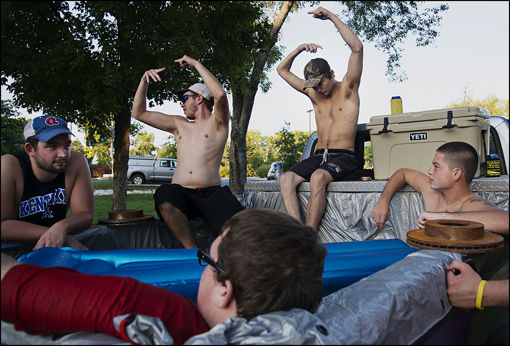  Members of the Alpha Gamma Row fraternity relax in a makeshift pool in the back of a truck just of the campus of WKU in Bowling Green, KY on Friday, September 5, 2014. Photos by Brian Powers 