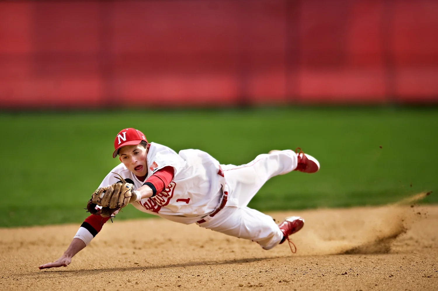  Naperville Central's Nick Ryan lays out for a catch during their game against Oswego at Naperville Central on Tuesday, March 27, 2012. | Brian Powers~Sun-Times Media 