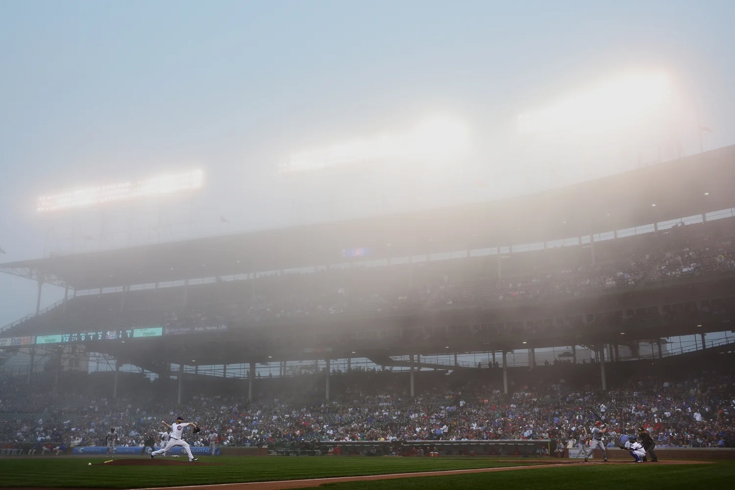  Heavy fog descends on Wrigley Field in Chicago as the Cubs take in the Cincinnati Reds in Chicago on Monday, June 10. 2013. Officials decided to play through the fog allowing the Reds to defeat the Cubs 6-2. 