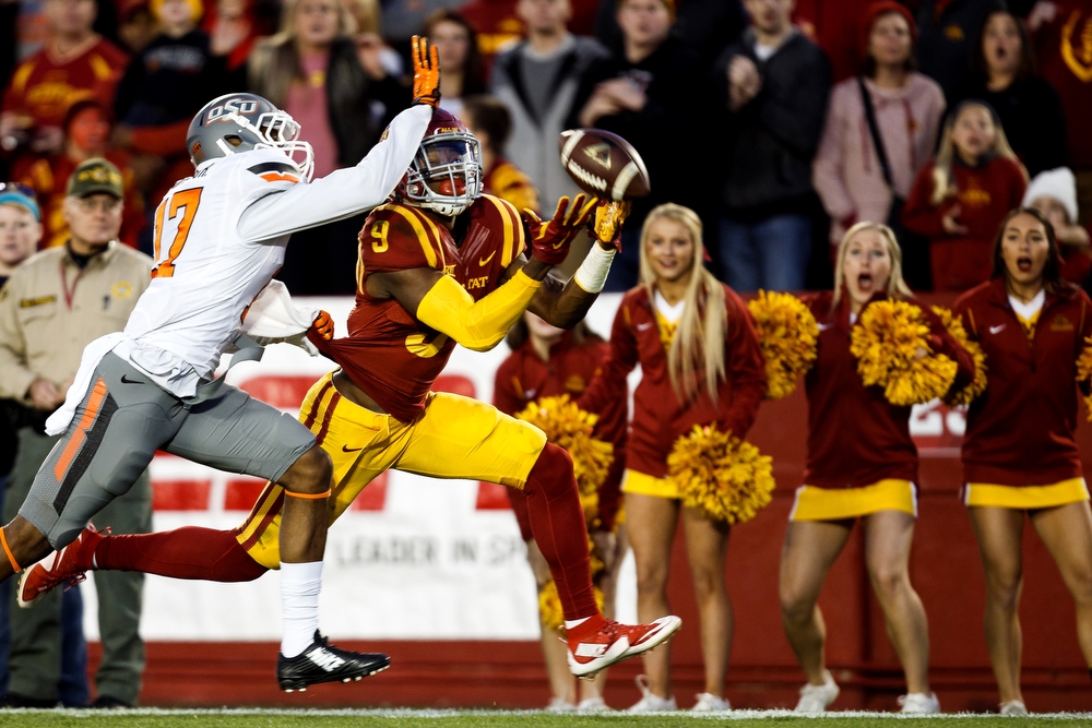  Iowa State's Quenton Bundrage can't come up with a pass as he is defended by Oklahoma State's Michael Hunter during their game at Jack Trice Stadium on Saturday, November 14, 2015 in Ames.
 