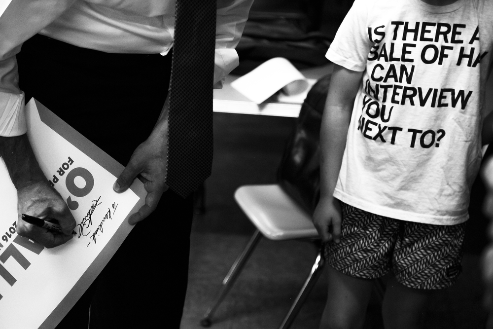  Democratic presidential candidate Martin O’Malley autographs a campaign sign during a stop at Trinity United Methodist Church in Des Moines on Thursday, July 16, 2015.  