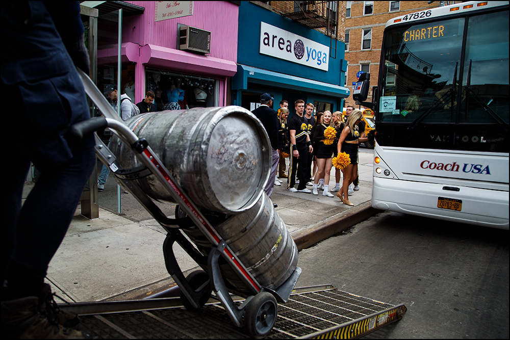  Members of the Iowa pep band and cheer squad return to their bus after greeting fans at The Montrose Bar in Brooklyn before the Hawkeyes take on Temple for their first round NCAA championship game on Friday, March 18, 2016. 